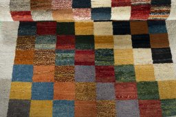 Full view of 2000s Persian Gabbeh rug from Iran / Persia, 140 × 96 cm in Multi Color tones