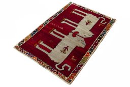 Corner detail of 2000s Persian Gabbeh rug showing border pattern and Wool pile