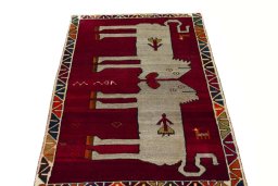 Surface texture of 2000s Persian Gabbeh rug with natural Wool and intricate pattern