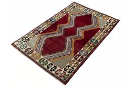 Corner detail of 2000s Persian Gabbeh rug showing border pattern and Wool pile