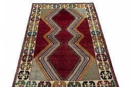 Surface texture of 2000s Persian Gabbeh rug with natural Wool and intricate pattern