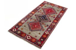 Corner detail of 2000s Persian Gabbeh rug showing border pattern and Wool pile