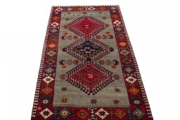 Surface texture of 2000s Persian Gabbeh rug with natural Wool and intricate pattern