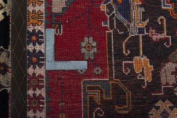 Surface texture of 2000s Persian Gabbeh rug with natural Wool and intricate pattern