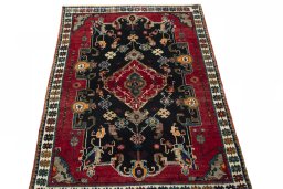Surface texture of 2000s Persian Gabbeh rug with natural Wool and intricate pattern