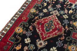 Backside of handmade 2000s Persian Gabbeh rug showing knot structure and weave density
