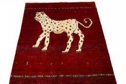 Surface texture of 2000s Persian Gabbeh rug with natural Wool and intricate pattern