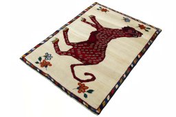 Corner detail of 2000s Persian Gabbeh rug showing border pattern and Wool pile