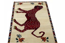 Surface texture of 2000s Persian Gabbeh rug with natural Wool and intricate pattern
