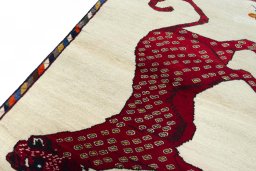Backside of handmade 2000s Persian Gabbeh rug showing knot structure and weave density