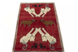 Surface texture of 2000s Persian Gabbeh rug with natural Wool and intricate pattern