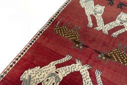 Backside of handmade 2000s Persian Gabbeh rug showing knot structure and weave density