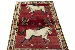 Surface texture of 2000s Persian Gabbeh rug with natural Wool and intricate pattern