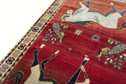 Backside of handmade 2000s Persian Gabbeh rug showing knot structure and weave density