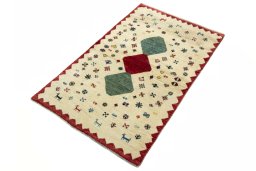 Corner detail of 2000s Persian Gabbeh rug showing border pattern and Wool pile