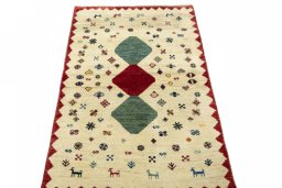 Surface texture of 2000s Persian Gabbeh rug with natural Wool and intricate pattern