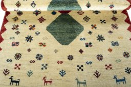 Full view of 2000s Persian Gabbeh rug from Iran / Persia, 167 × 101 cm in Beige tones