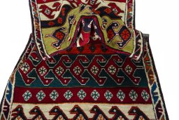 Corner detail of 2000s Persian Gabbeh rug showing border pattern and Wool pile