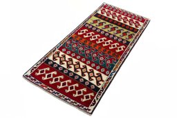 Corner detail of 2000s Persian Gabbeh rug showing border pattern and Wool pile