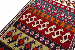 Backside of handmade 2000s Persian Gabbeh rug showing knot structure and weave density