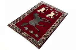 Corner detail of 2000s Persian Gabbeh rug showing border pattern and Wool pile