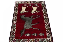 Surface texture of 2000s Persian Gabbeh rug with natural Wool and intricate pattern