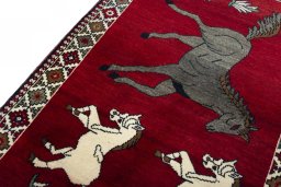 Backside of handmade 2000s Persian Gabbeh rug showing knot structure and weave density