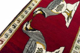 Backside of handmade 2000s Persian Gabbeh rug showing knot structure and weave density
