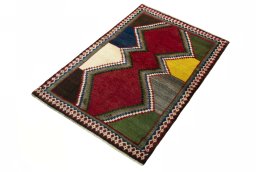 Corner detail of 2000s Persian Gabbeh rug showing border pattern and Wool pile