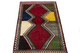 Surface texture of 2000s Persian Gabbeh rug with natural Wool and intricate pattern