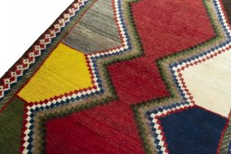 Backside of handmade 2000s Persian Gabbeh rug showing knot structure and weave density