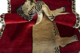 Corner detail of 2000s Persian Gabbeh rug showing border pattern and Wool pile