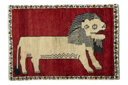 Full view of 2000s Persian Gabbeh rug from Iran / Persia, 149 × 102 cm in Red tones