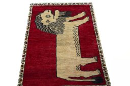 Surface texture of 2000s Persian Gabbeh rug with natural Wool and intricate pattern
