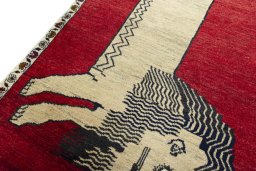 Backside of handmade 2000s Persian Gabbeh rug showing knot structure and weave density