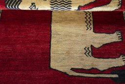 Full view of 2000s Persian Gabbeh rug from Iran / Persia, 149 × 102 cm in Red tones