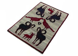 Corner detail of 2000s Persian Gabbeh rug showing border pattern and Wool pile