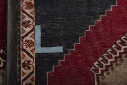 Surface texture of 2000s Persian Gabbeh rug with natural Wool and intricate pattern