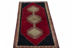 Surface texture of 2000s Persian Gabbeh rug with natural Wool and intricate pattern