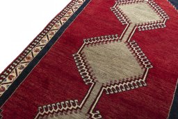 Backside of handmade 2000s Persian Gabbeh rug showing knot structure and weave density