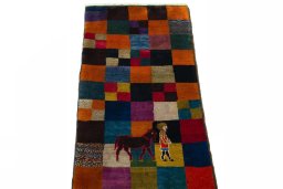 Surface texture of 2000s Persian Gabbeh rug with natural Wool and intricate pattern
