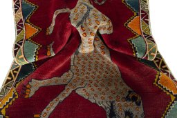 Corner detail of 2000s Persian Gabbeh rug showing border pattern and Wool pile