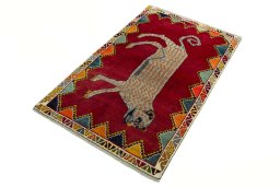 Corner detail of 2000s Persian Gabbeh rug showing border pattern and Wool pile