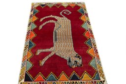 Surface texture of 2000s Persian Gabbeh rug with natural Wool and intricate pattern