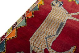 Backside of handmade 2000s Persian Gabbeh rug showing knot structure and weave density