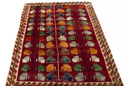 Surface texture of 2000s Persian Gabbeh rug with natural Wool and intricate pattern
