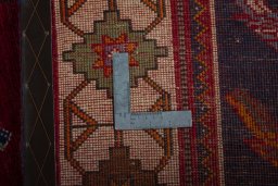 Surface texture of 2000s Persian Gabbeh rug with natural Wool and intricate pattern