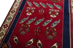 Backside of handmade 2000s Persian Gabbeh rug showing knot structure and weave density