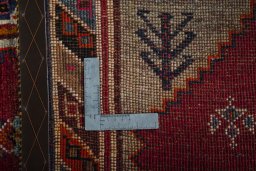 Surface texture of 2000s Persian Gabbeh rug with natural Wool and intricate pattern