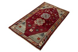 Corner detail of 2000s Persian Gabbeh rug showing border pattern and Wool pile